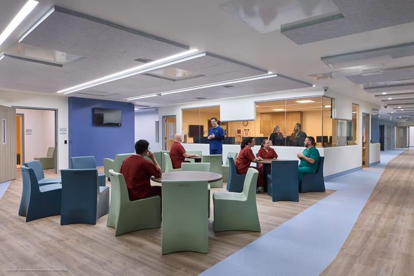 Photo of several colleagues collaborating in a Connections Health facility common area